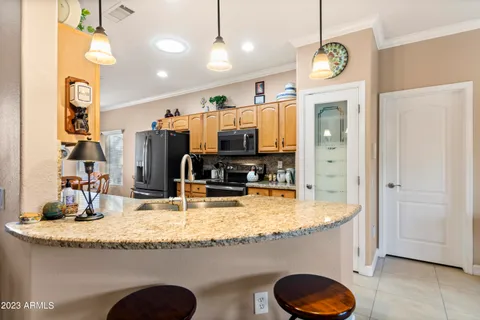 a view of living room with granite countertop furniture and fireplace