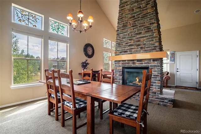 a dining room with furniture window and wooden floor