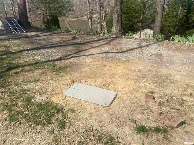 a backyard of a house with barbeque oven