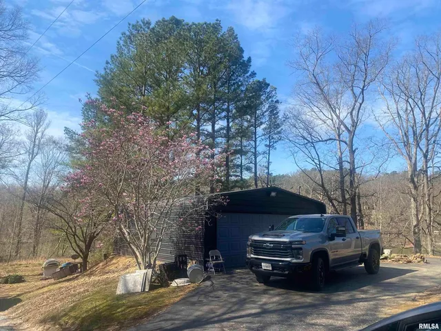 a view of backyard and blue space