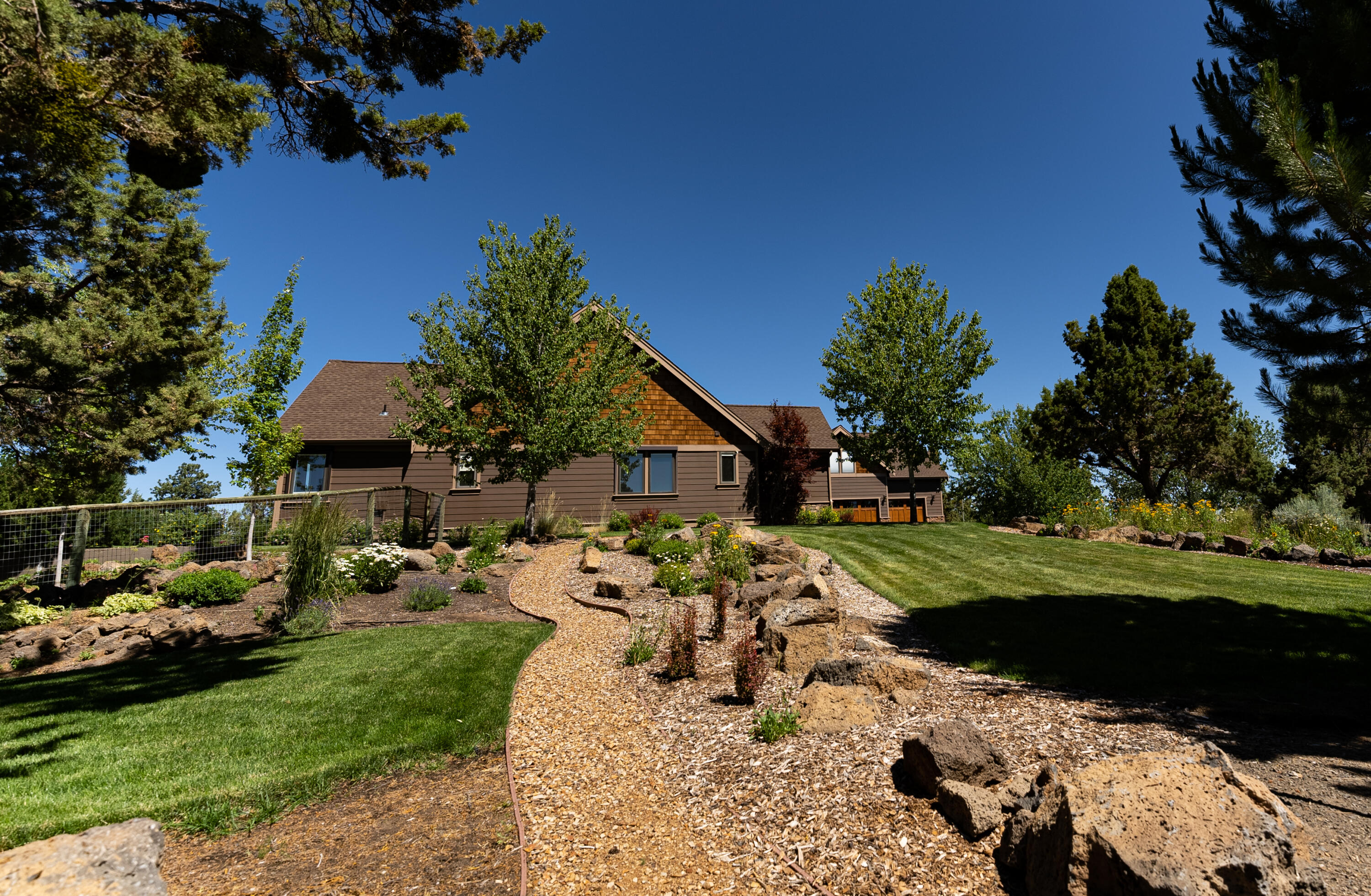 63545 Overtree Road Bend, OR 97701 - Photo 55 of 63 walkway to lower turnaround drive with RV hookups