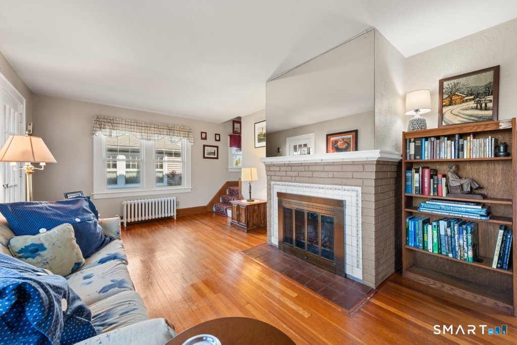75 Elizabeth Terrace Stratford, CT 06614 - Photo 11 of 38 a living room with furniture and a fireplace