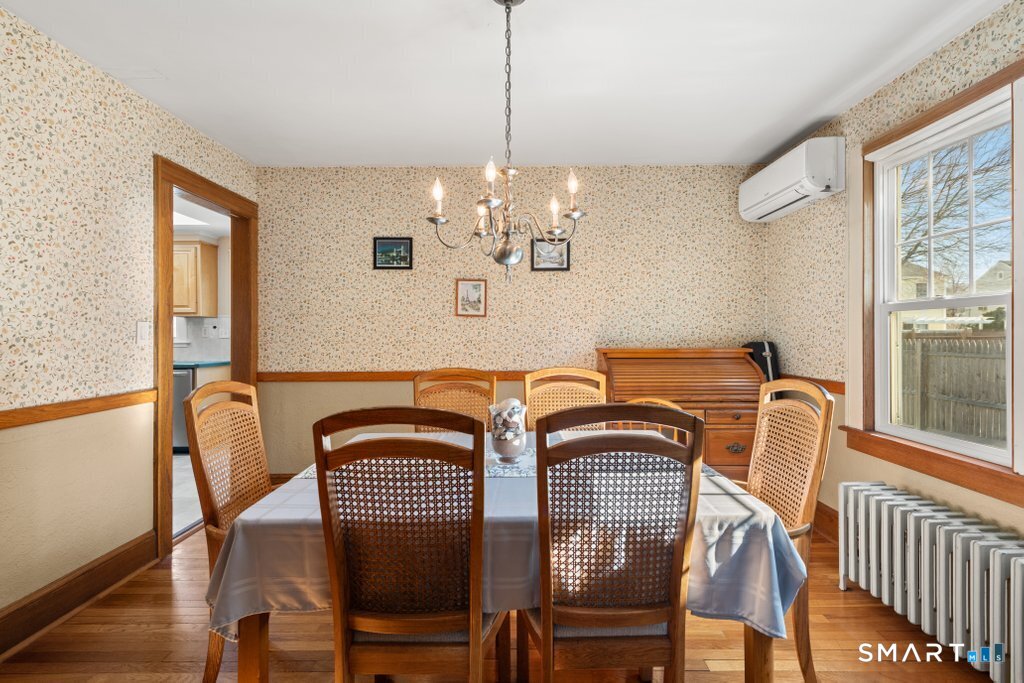 75 Elizabeth Terrace Stratford, CT 06614 - Photo 16 of 38 a view of a dining room with furniture window and wooden floor