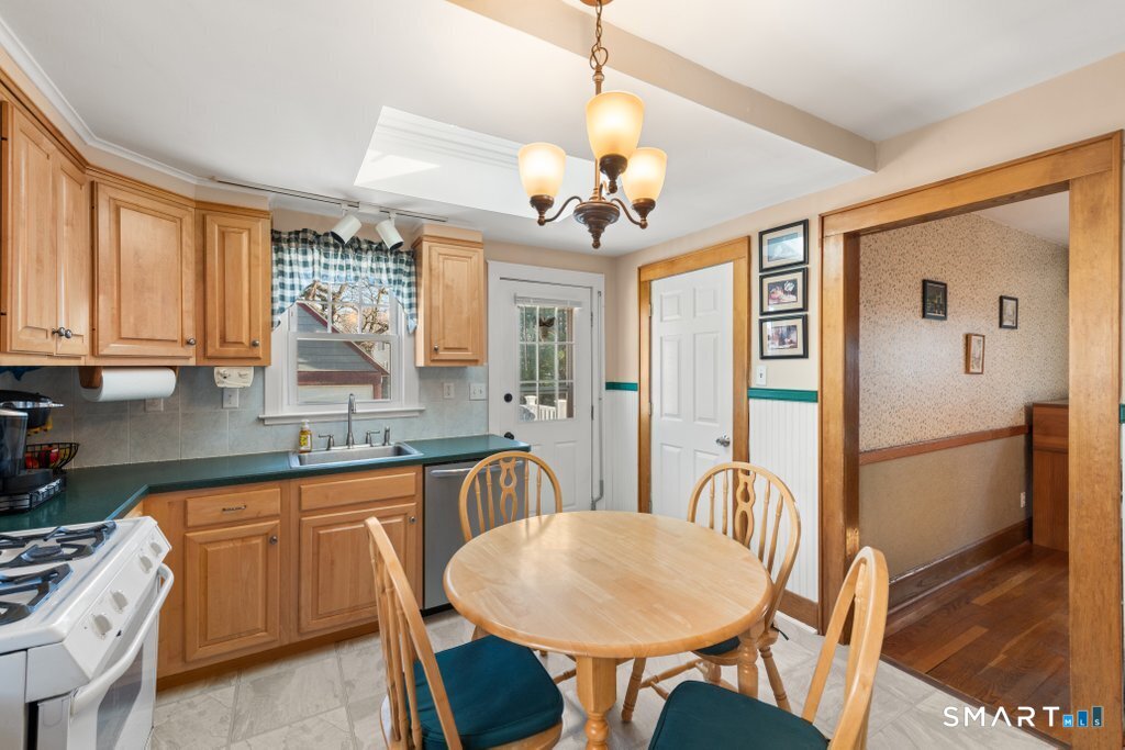 75 Elizabeth Terrace Stratford, CT 06614 - Photo 17 of 38 a view of a dining room with furniture window and wooden floor