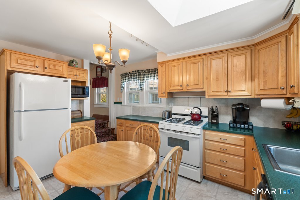 75 Elizabeth Terrace Stratford, CT 06614 - Photo 19 of 38 a kitchen that has a cabinets counter space stainless steel appliances and cabinets