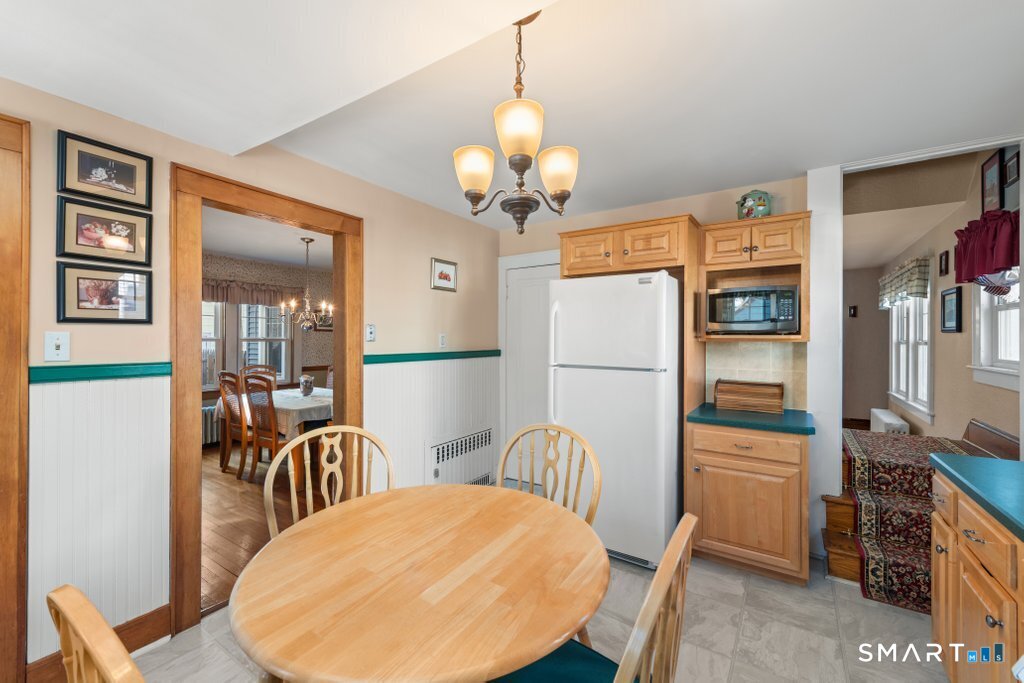75 Elizabeth Terrace Stratford, CT 06614 - Photo 20 of 38 a view of a dining room with furniture and wooden floor