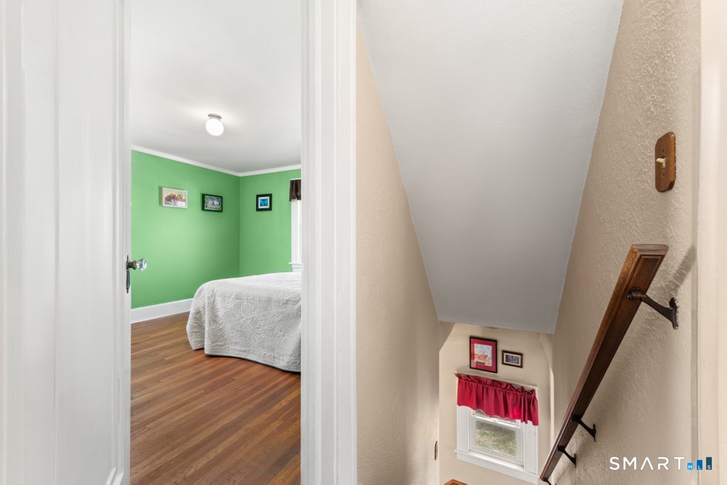 75 Elizabeth Terrace Stratford, CT 06614 - Photo 23 of 38 a living room with furniture and a wooden floor