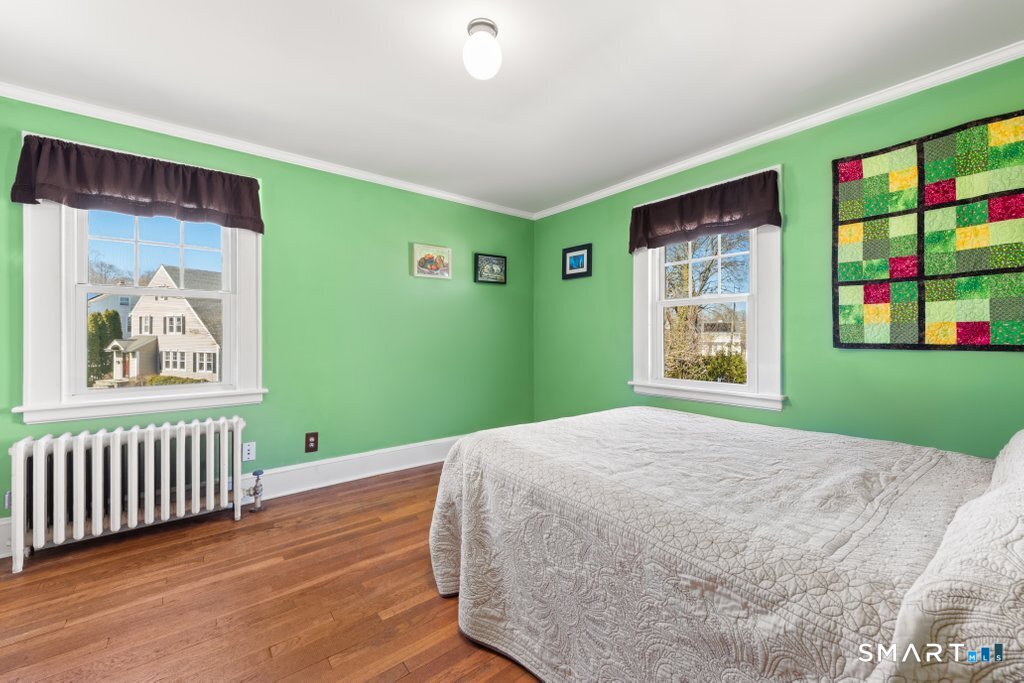 75 Elizabeth Terrace Stratford, CT 06614 - Photo 24 of 38 a bedroom with window and a bed