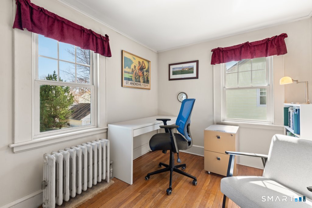 75 Elizabeth Terrace Stratford, CT 06614 - Photo 26 of 38 a view of a workspace with furniture and a window