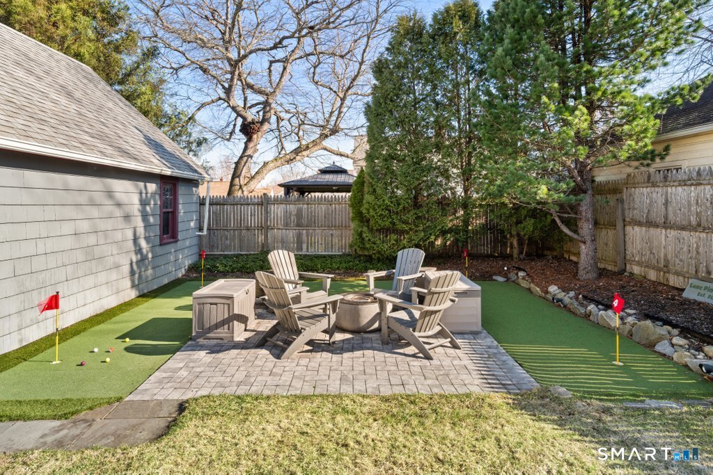 75 Elizabeth Terrace Stratford, CT 06614 - Photo 5 of 38 a view of a chair and table in backyard of the house
