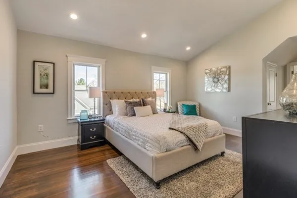 a spacious bedroom with a bed and window