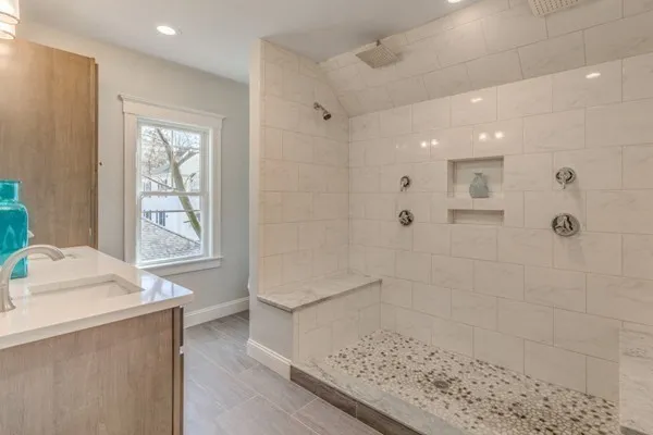 a bathroom with a bathtub and shower