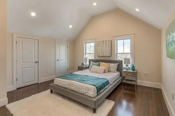 a bedroom with a bed and window