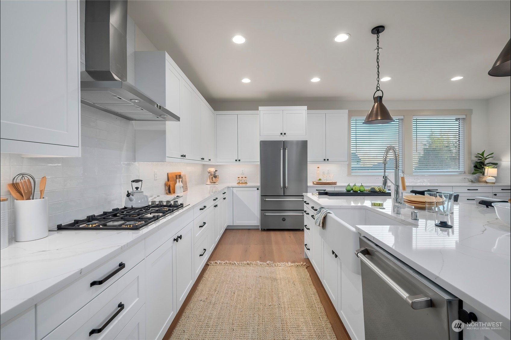 316 174th Street Southeast Bothell, WA 98012 - Photo 10 of 36 a large kitchen with stainless steel appliances sink a stove and cabinets