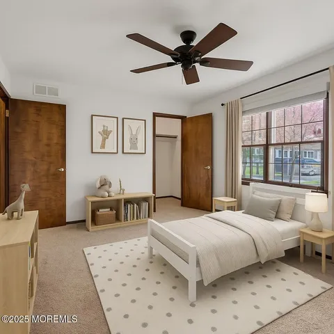 a bedroom with a large bed and a couch