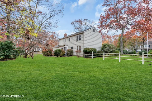 a view of a house with a back yard