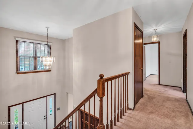 a view of a hallway with windows