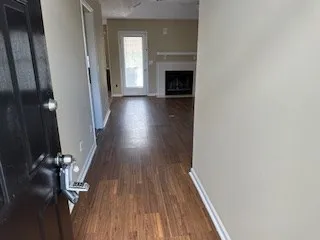 a view of entryway with wooden floor