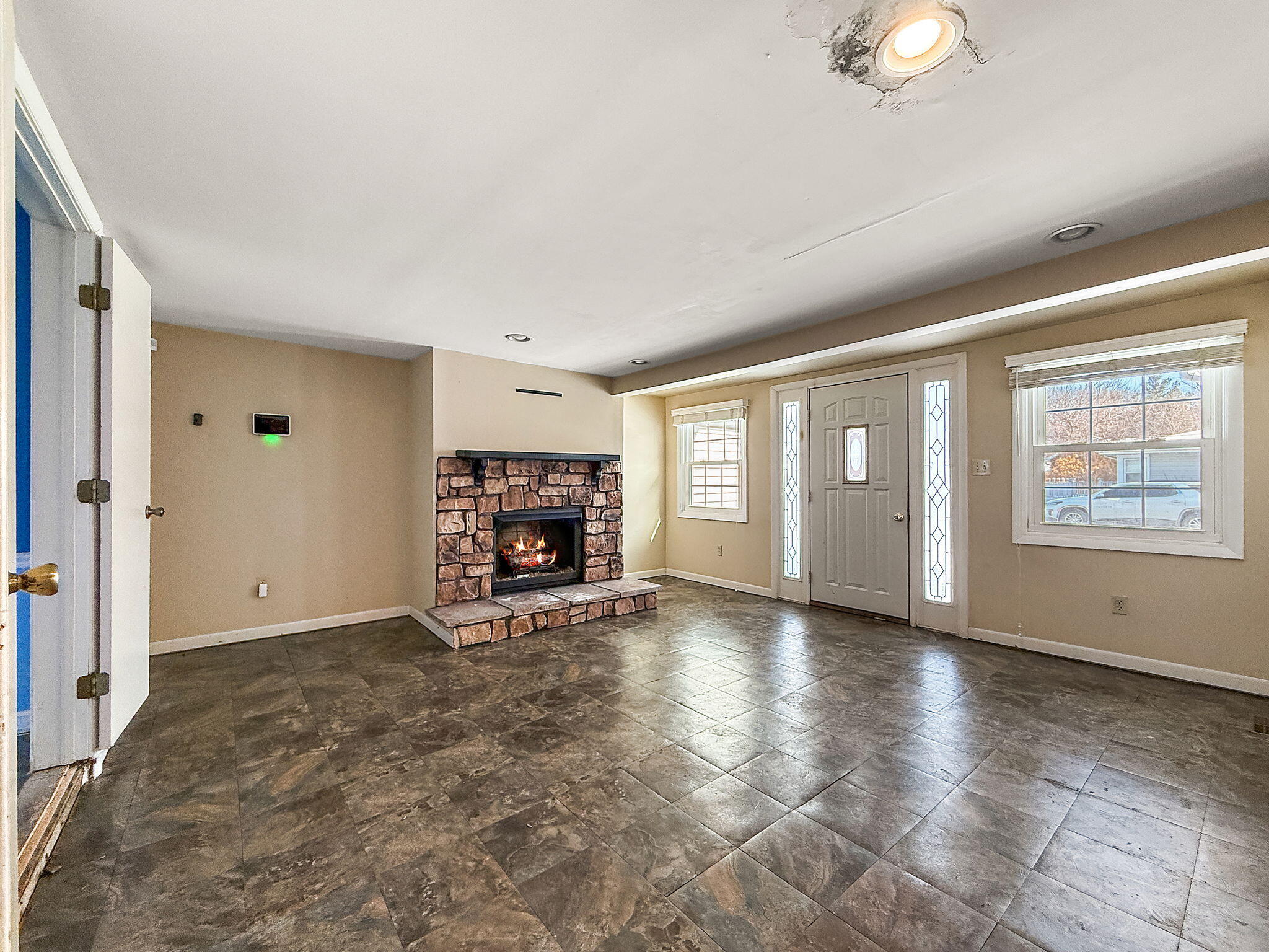 3339 Wirth Road Highland, IN 46322 - Photo 15 of 29 an empty room with windows fireplace and fans