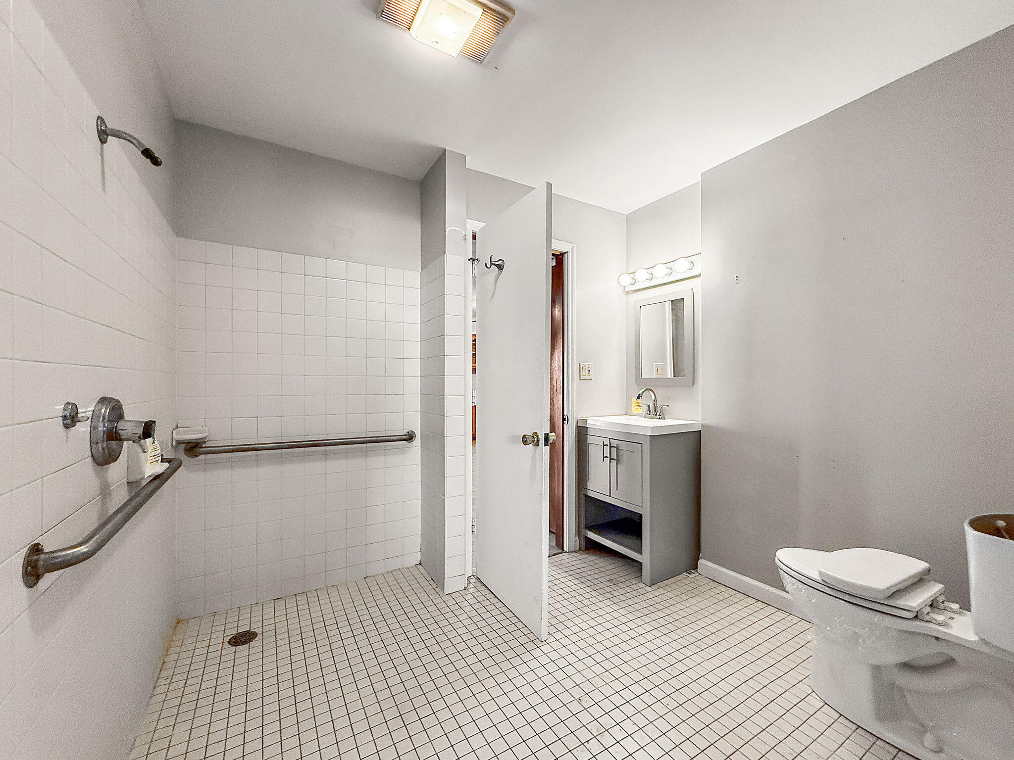 3339 Wirth Road Highland, IN 46322 - Photo 18 of 29 a bathroom with a sink a toilet a shower and a mirror