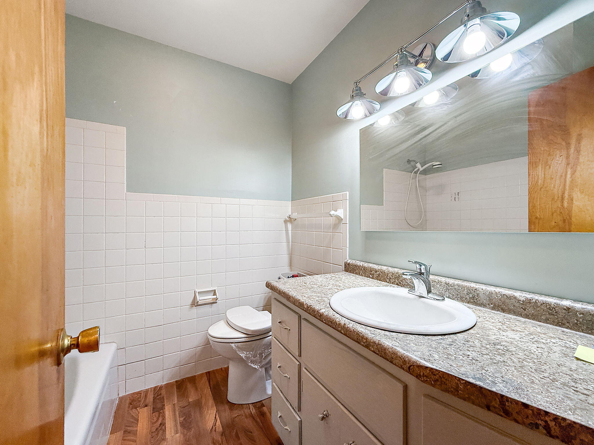 3339 Wirth Road Highland, IN 46322 - Photo 22 of 29 a bathroom with a granite countertop sink a toilet and a mirror