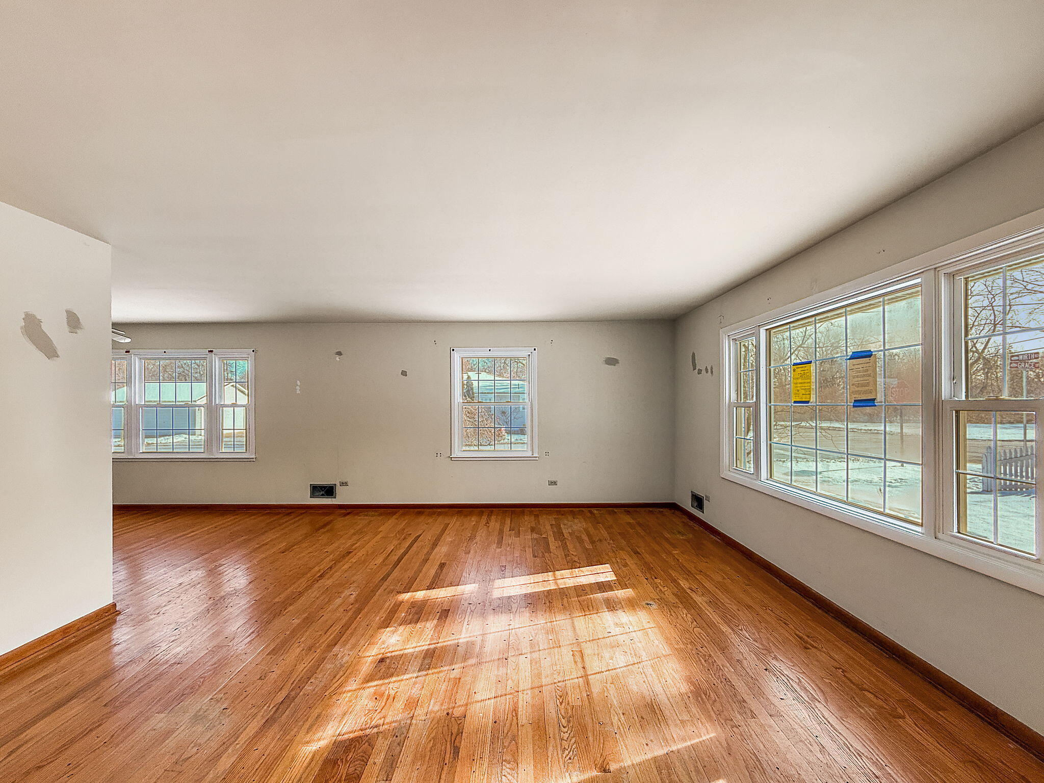 3339 Wirth Road Highland, IN 46322 - Photo 8 of 29 an empty room with wooden floor and windows