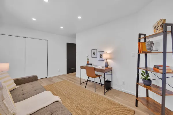 a workspace with furniture and wooden floor