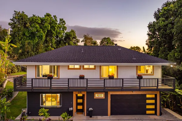 a view of a house with a swimming pool and a porch