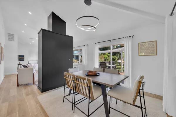 a view of a dining room with furniture and window