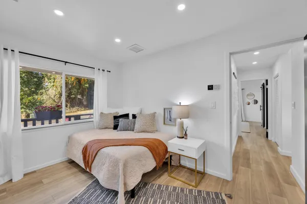 a bed room with a bed and a window