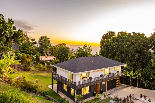 a aerial view of a house with a yard