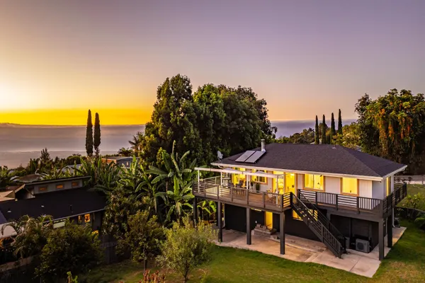 a view of a chairs and table in the roof deck