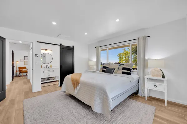 a bedroom with a bed and dresser