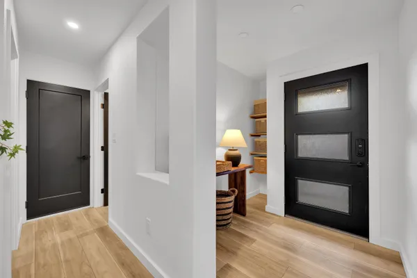 a view of a room that has a bed and a window in it