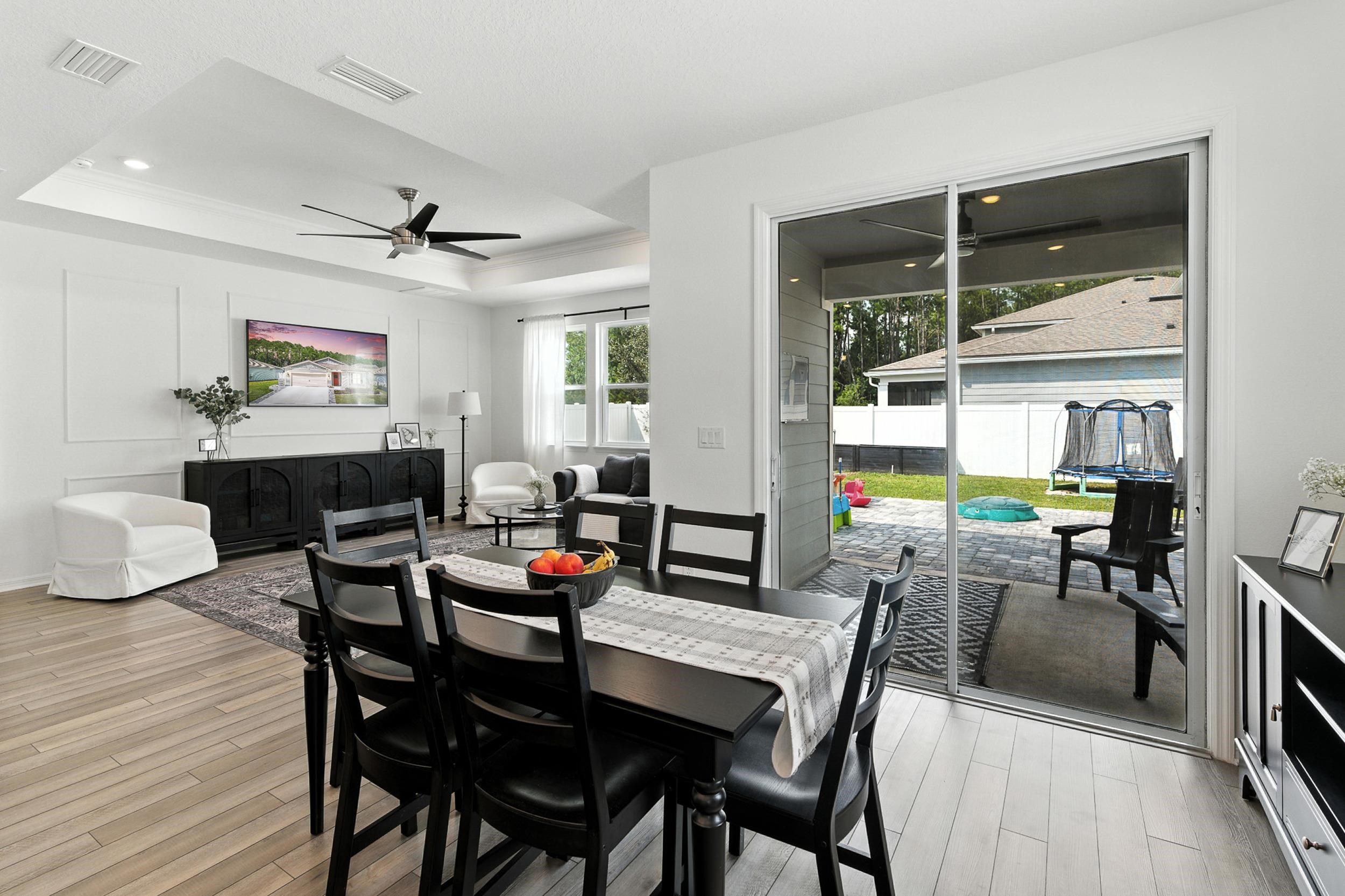 196 Red Barn Rd Street St. Augustine, FL 32092 - Photo 15 of 53 a dining room with wooden floor and a window