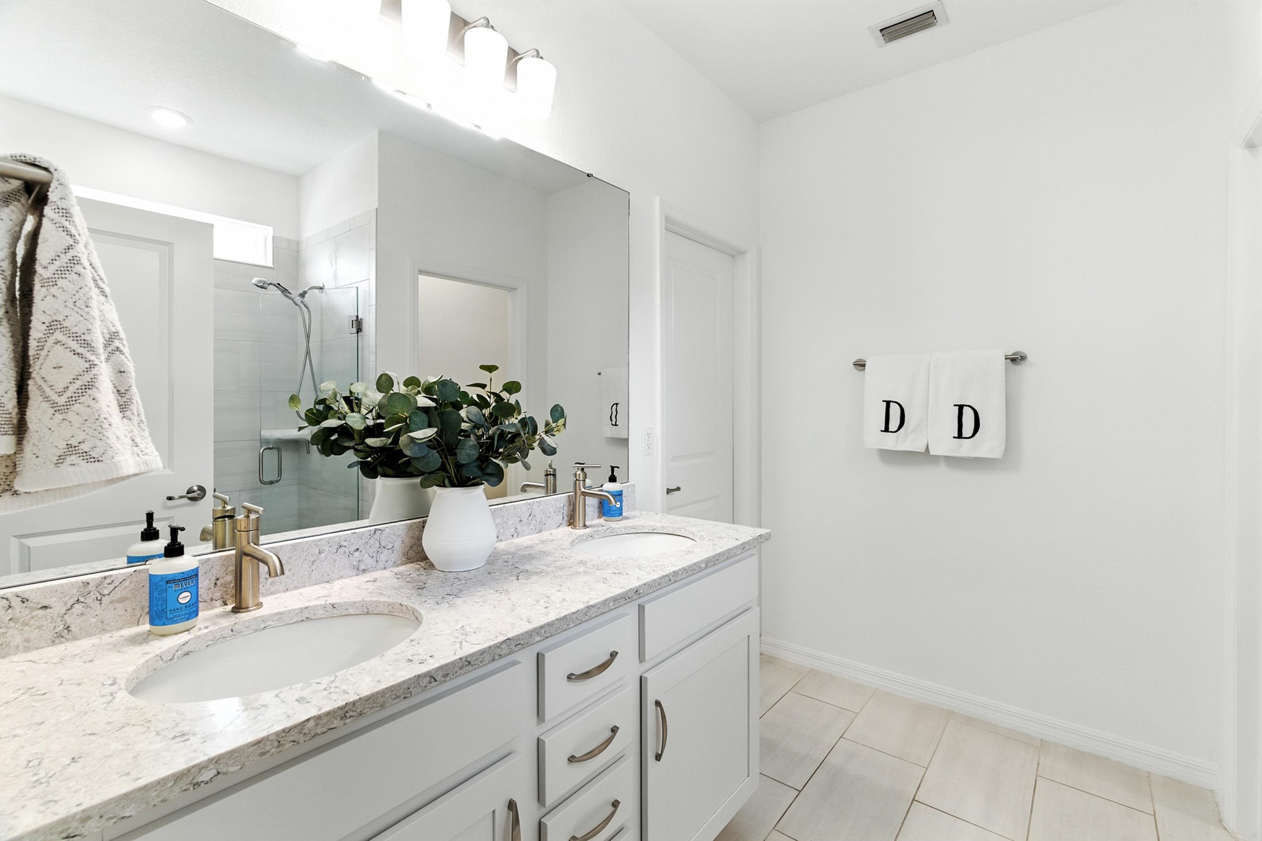 196 Red Barn Rd Street St. Augustine, FL 32092 - Photo 19 of 53 a bathroom with a sink a vanity and a mirror