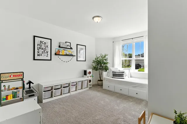 a bathroom with a granite countertop sink toilet and a mirror