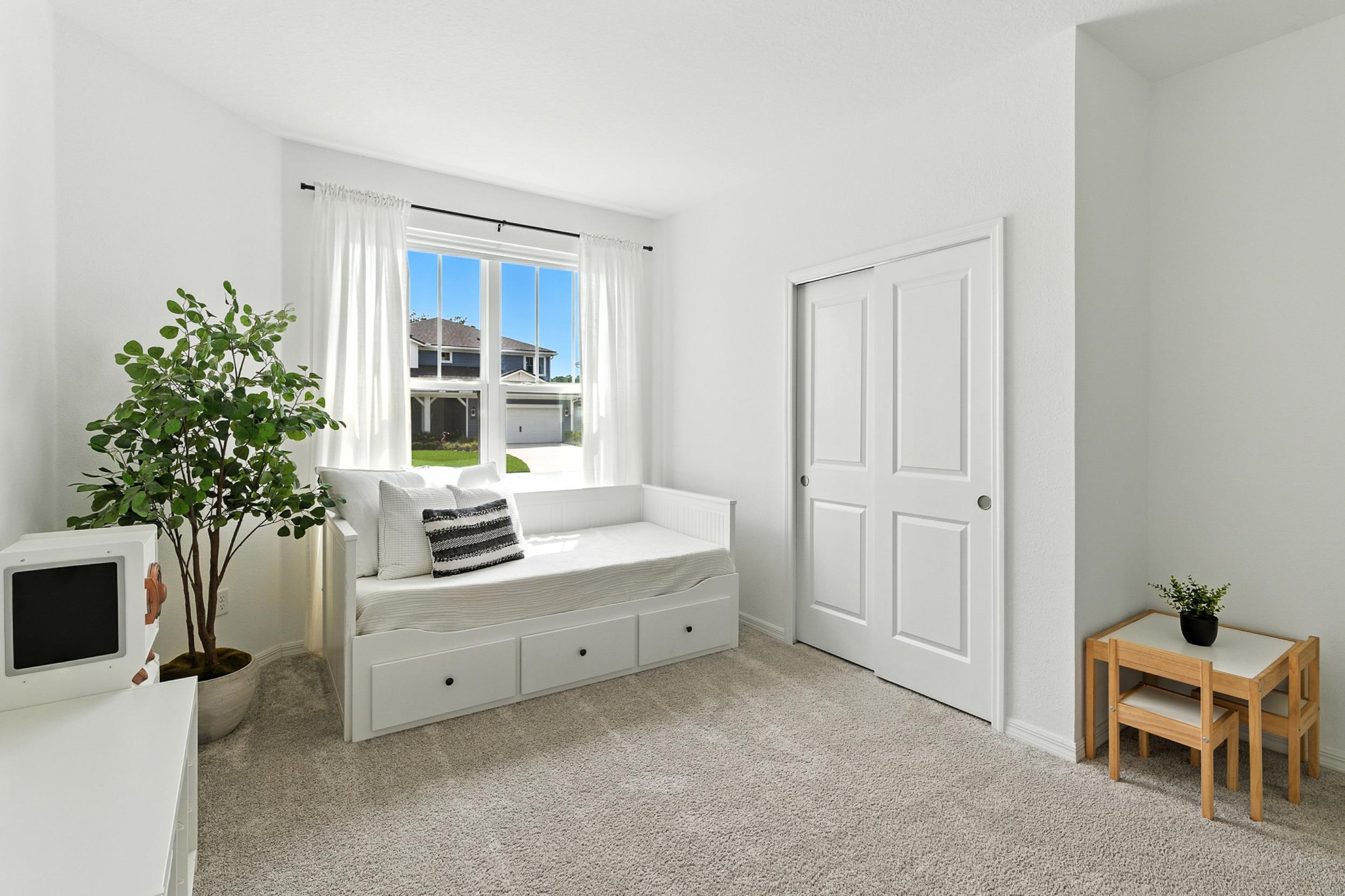 196 Red Barn Rd Street St. Augustine, FL 32092 - Photo 21 of 53 a room with a chair and a dresser