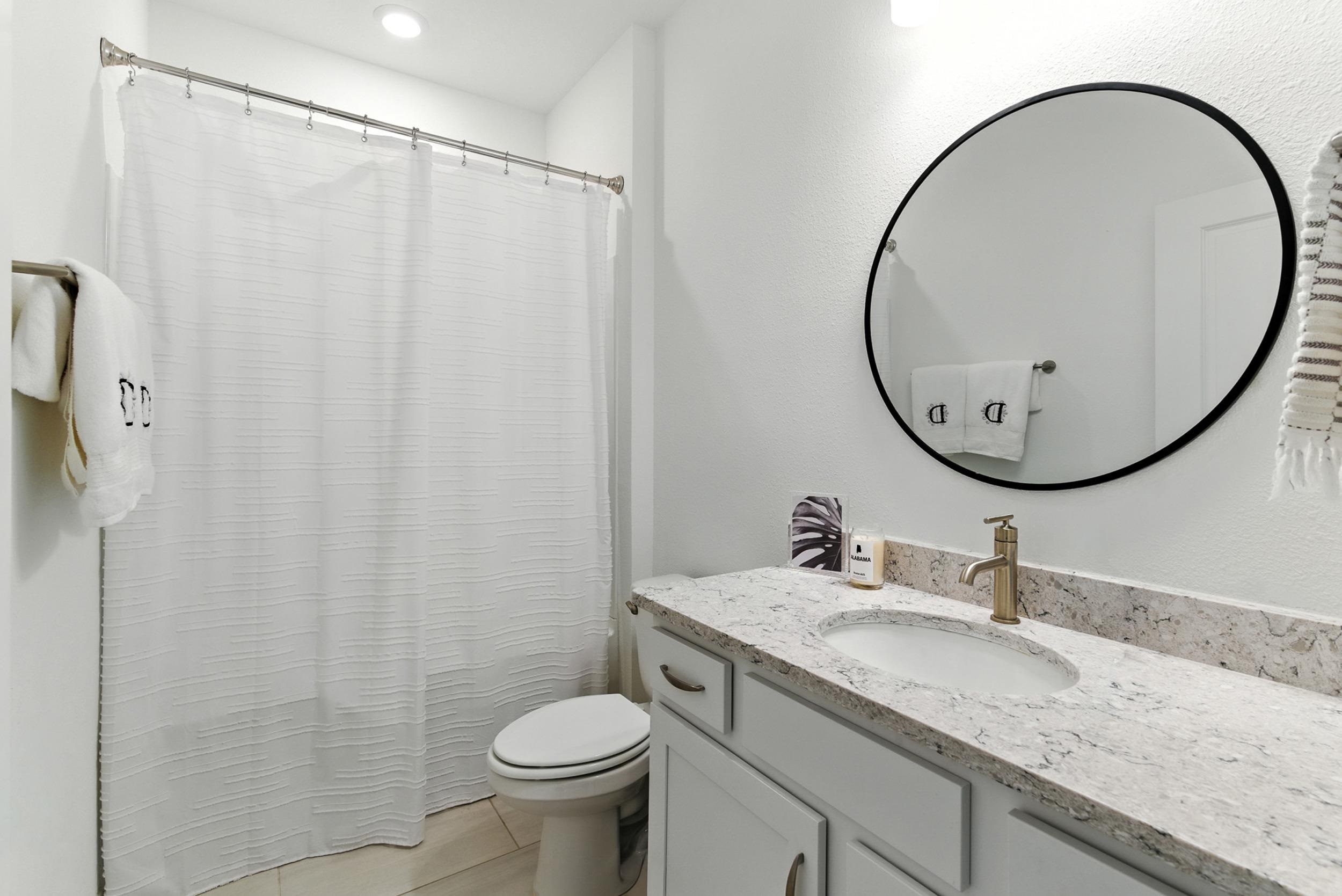 196 Red Barn Rd Street St. Augustine, FL 32092 - Photo 23 of 53 a bathroom with a granite countertop sink toilet and a mirror