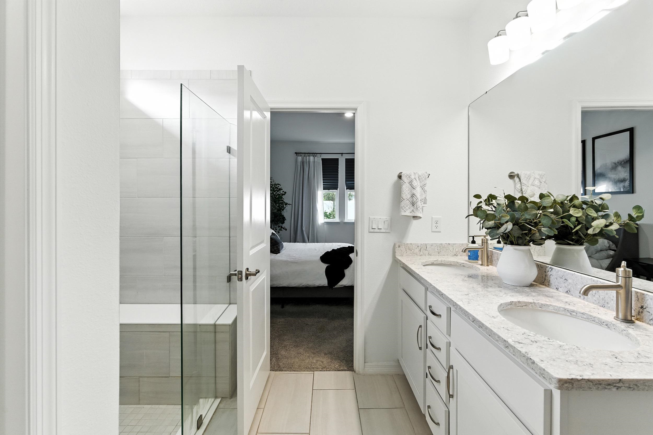 196 Red Barn Rd Street St. Augustine, FL 32092 - Photo 6 of 53 a en suite bathroom with a granite countertop sink and a mirror