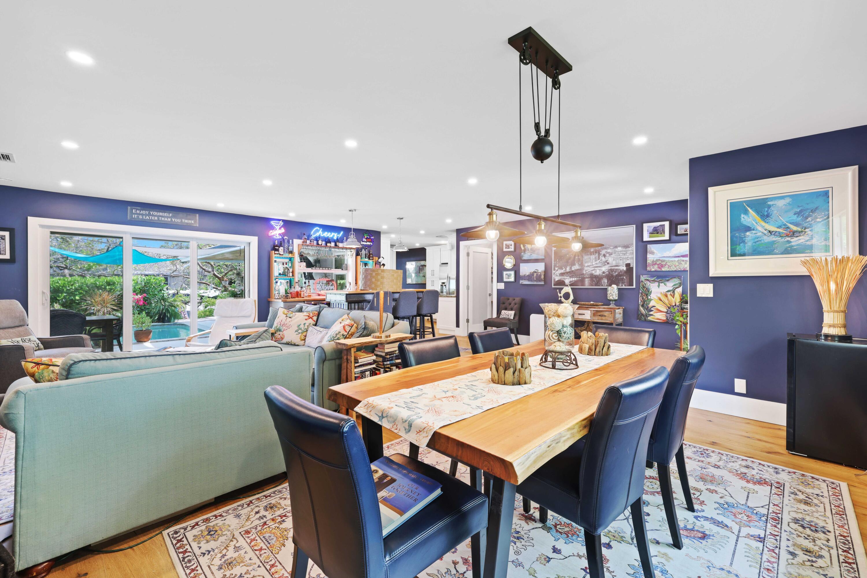 784 Dover Street Boca Raton, FL 33487 - Photo 12 of 78 a dining room with furniture a rug and a chandelier