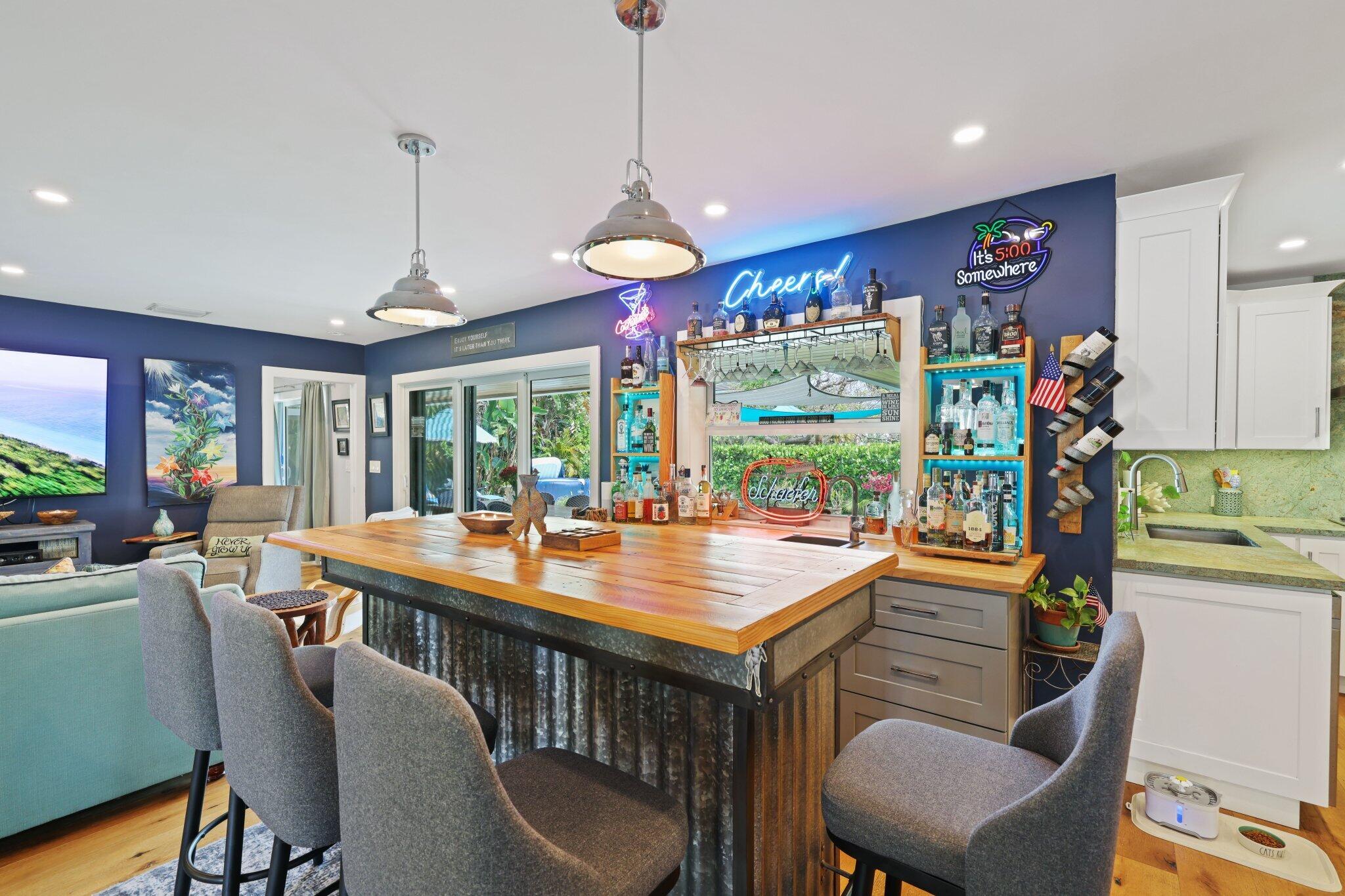 784 Dover Street Boca Raton, FL 33487 - Photo 23 of 78 a dining room with wooden floor a chandelier a wooden table and chairs