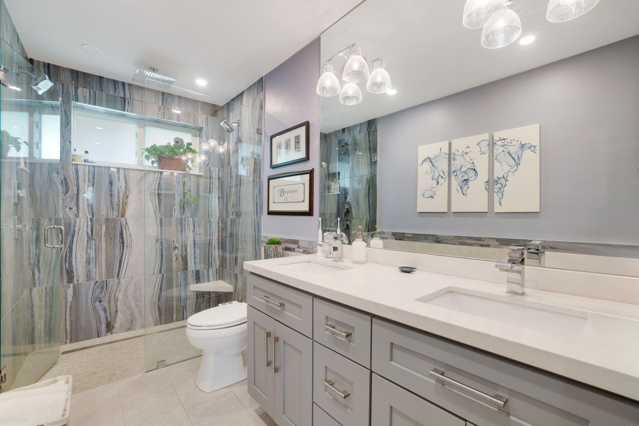 784 Dover Street Boca Raton, FL 33487 - Photo 28 of 78 a bathroom with a double vanity sink toilet and a mirror