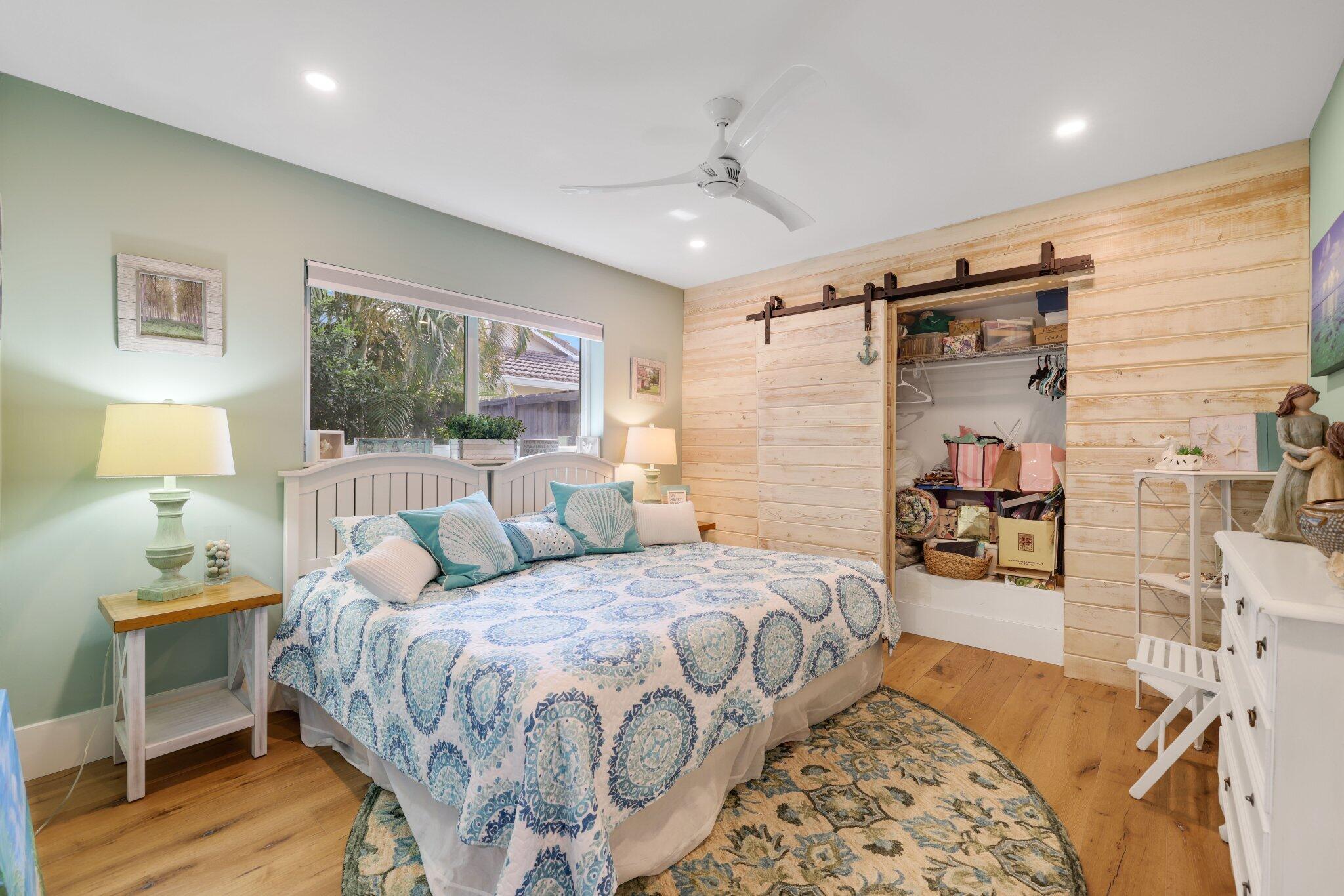 784 Dover Street Boca Raton, FL 33487 - Photo 36 of 78 a bedroom with a bed and wooden floor