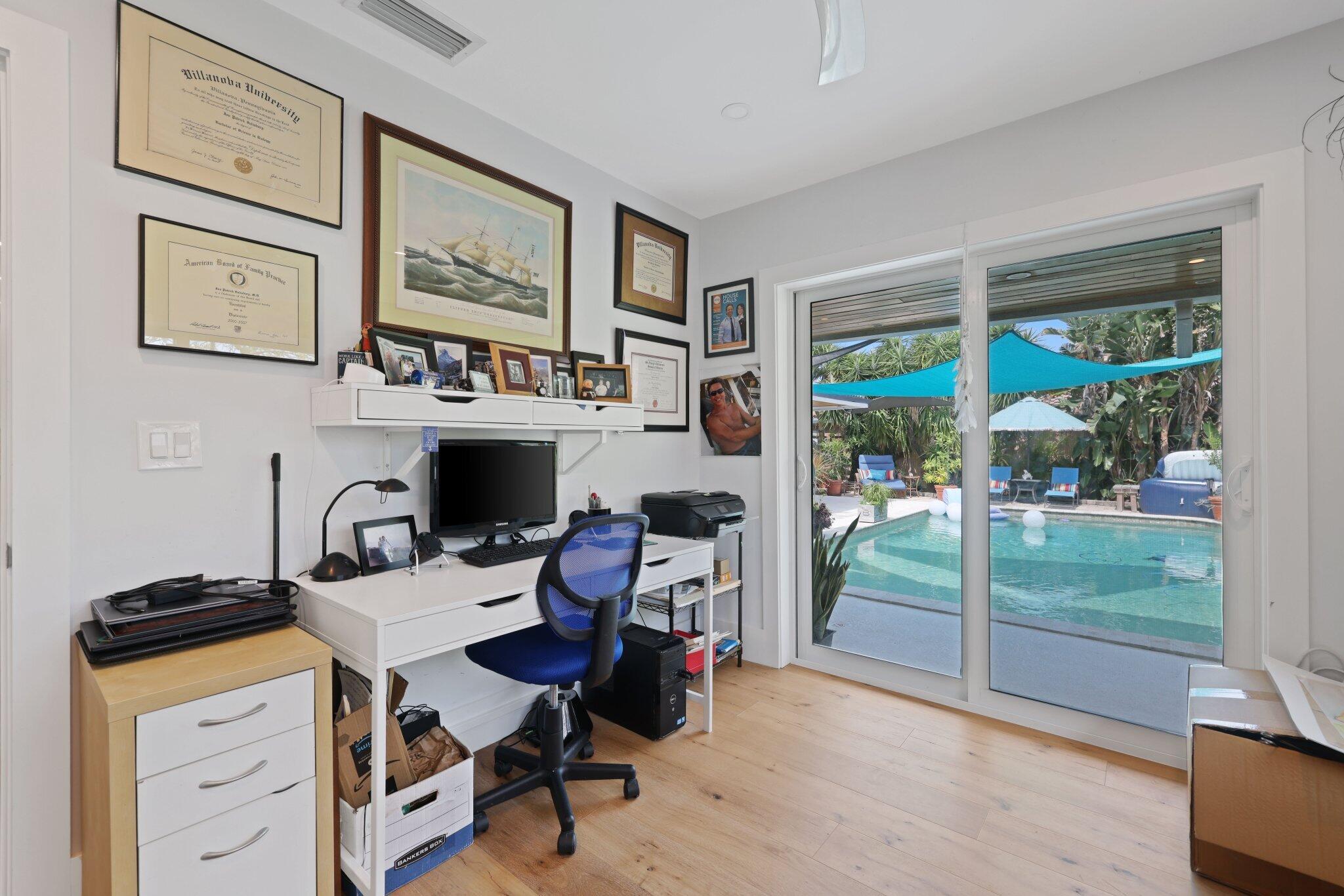 784 Dover Street Boca Raton, FL 33487 - Photo 40 of 78 a view of a workspace with furniture and a gate