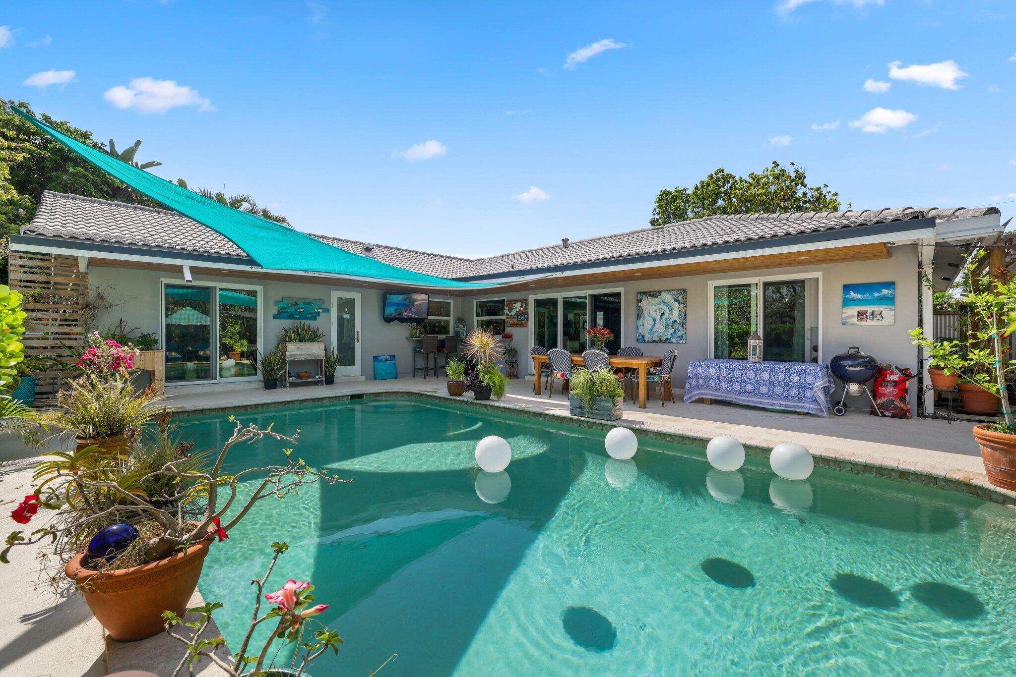 784 Dover Street Boca Raton, FL 33487 - Photo 45 of 78 a view of a house with backyard tub and porch