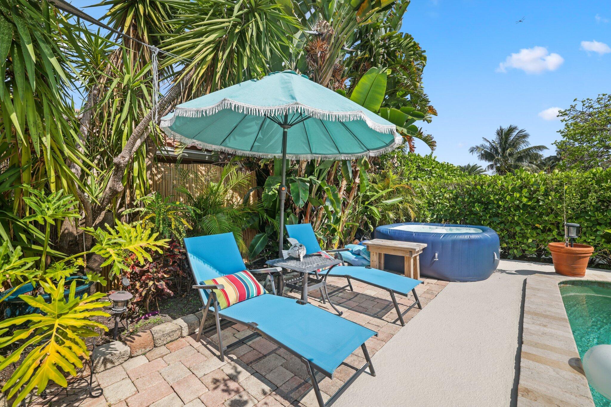 784 Dover Street Boca Raton, FL 33487 - Photo 48 of 78 a view of backyard with outdoor seating and trees