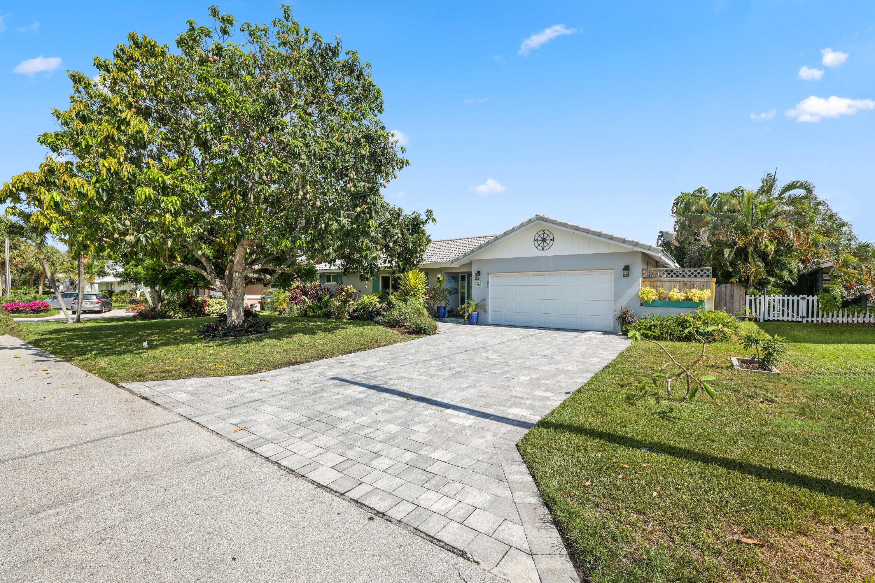 784 Dover Street Boca Raton, FL 33487 - Photo 6 of 78 front view of a house with a yard