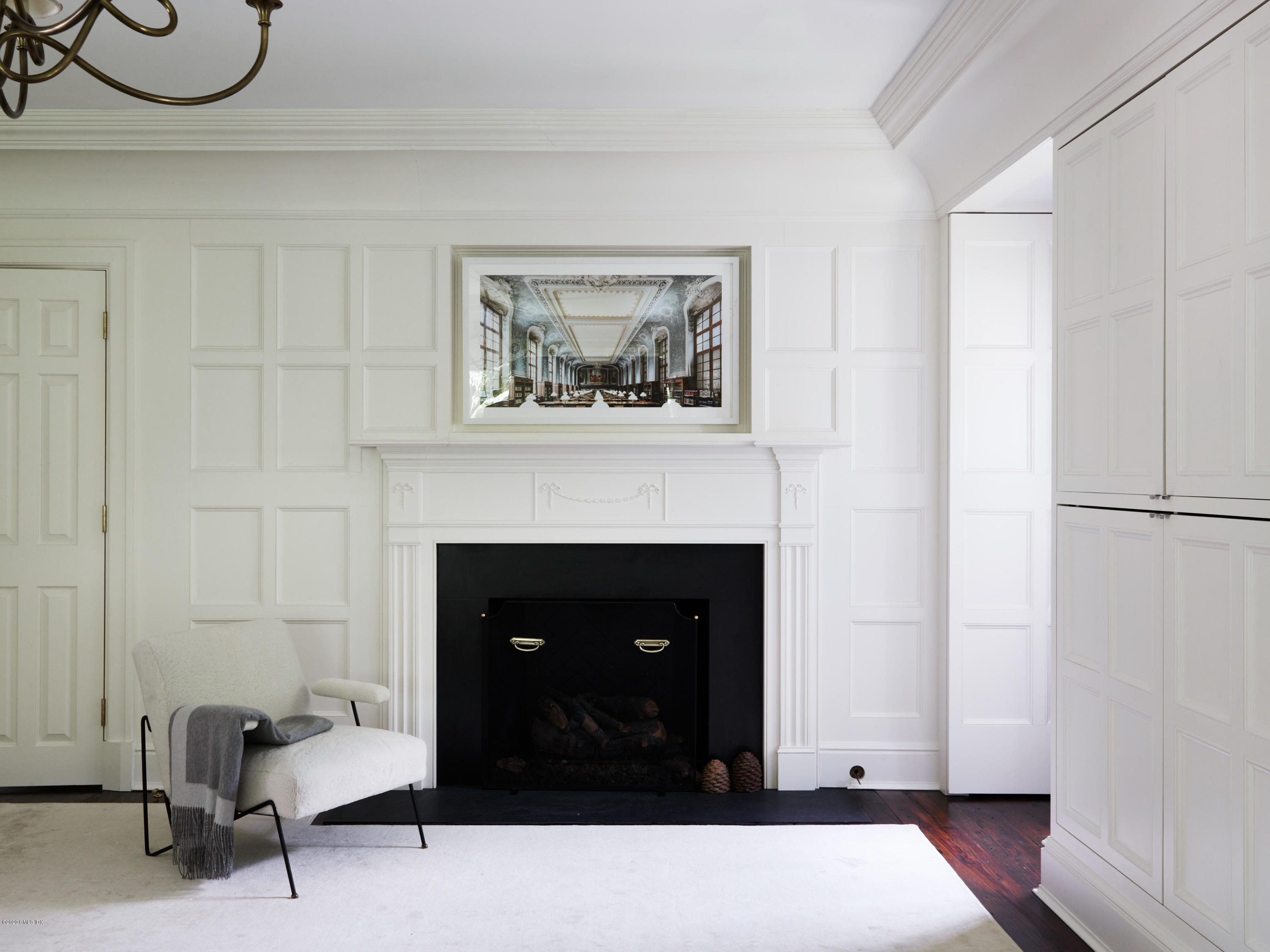 74 Upper Cross Road Greenwich, CT 06831 - Photo 23 of 40 a living room with furniture and a fireplace