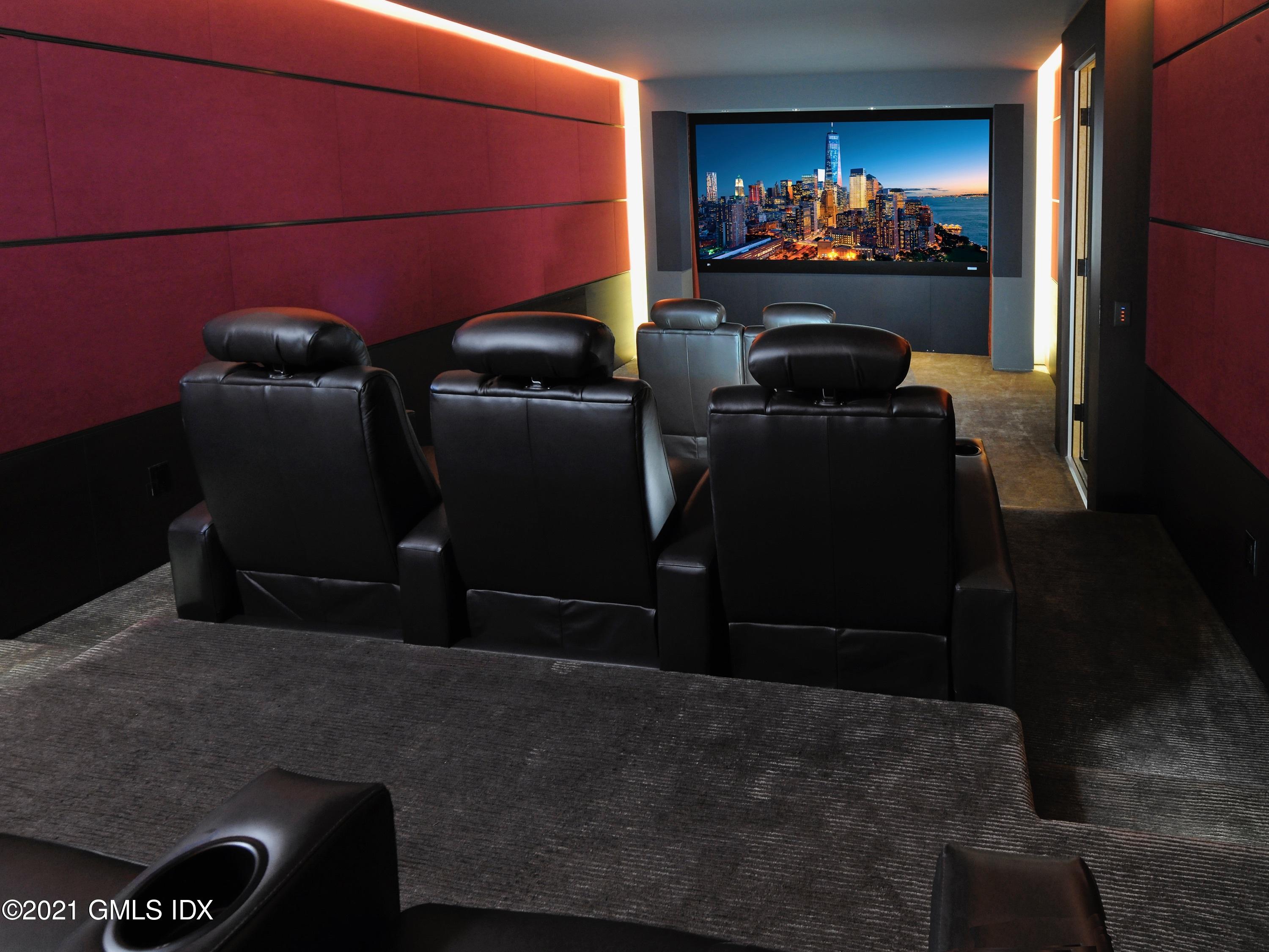 74 Upper Cross Road Greenwich, CT 06831 - Photo 29 of 40 a room with furniture and a flat screen tv